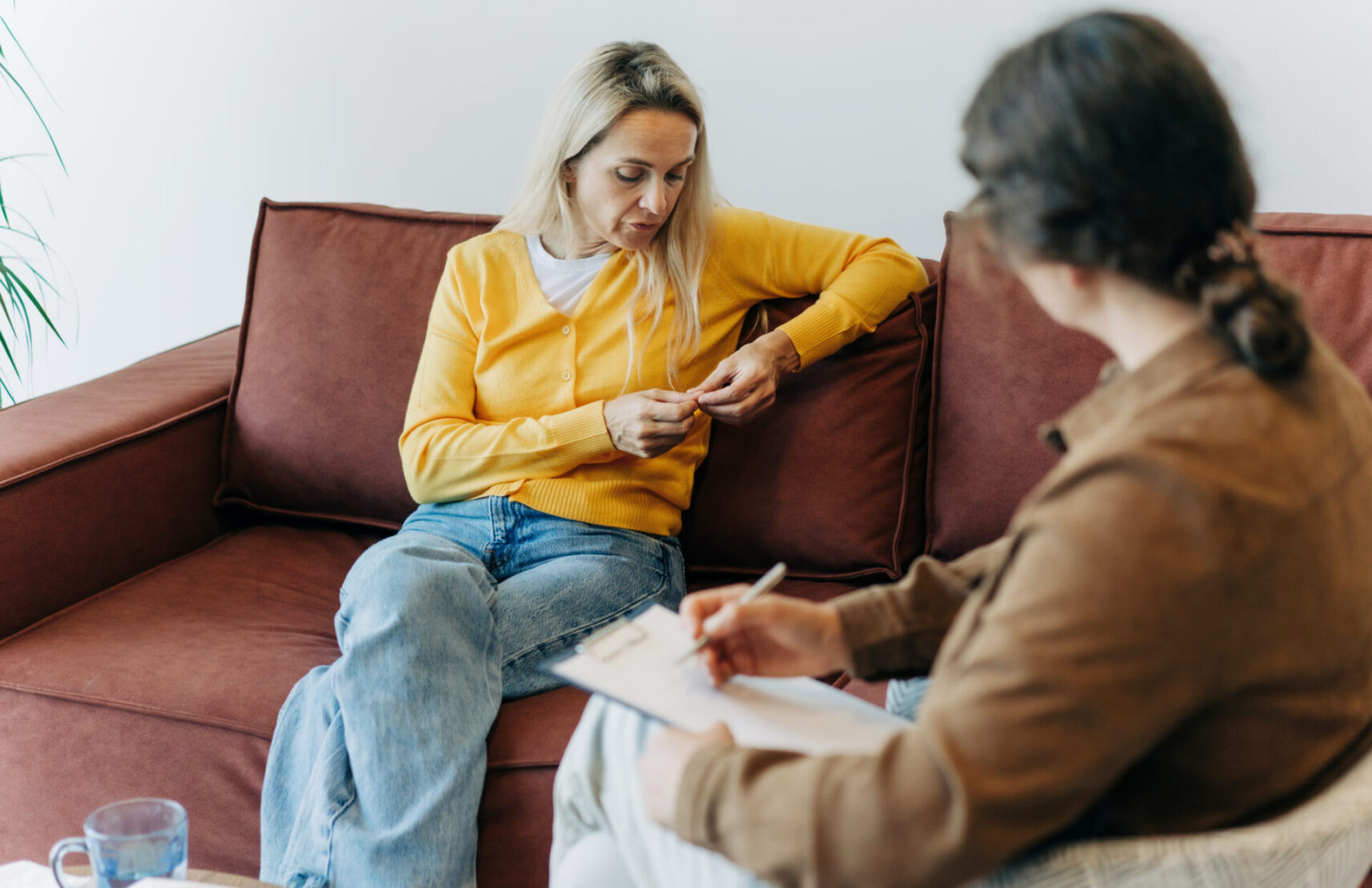 a-woman-patient-sitting-on-the-couch-during-a-con-2026-01-08-06-42-27-utc-aspect-ratio-1712-1108